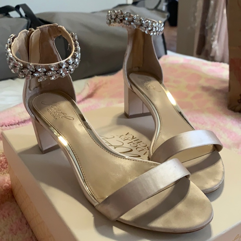 Tan silk open toed heal with rhinestone details.